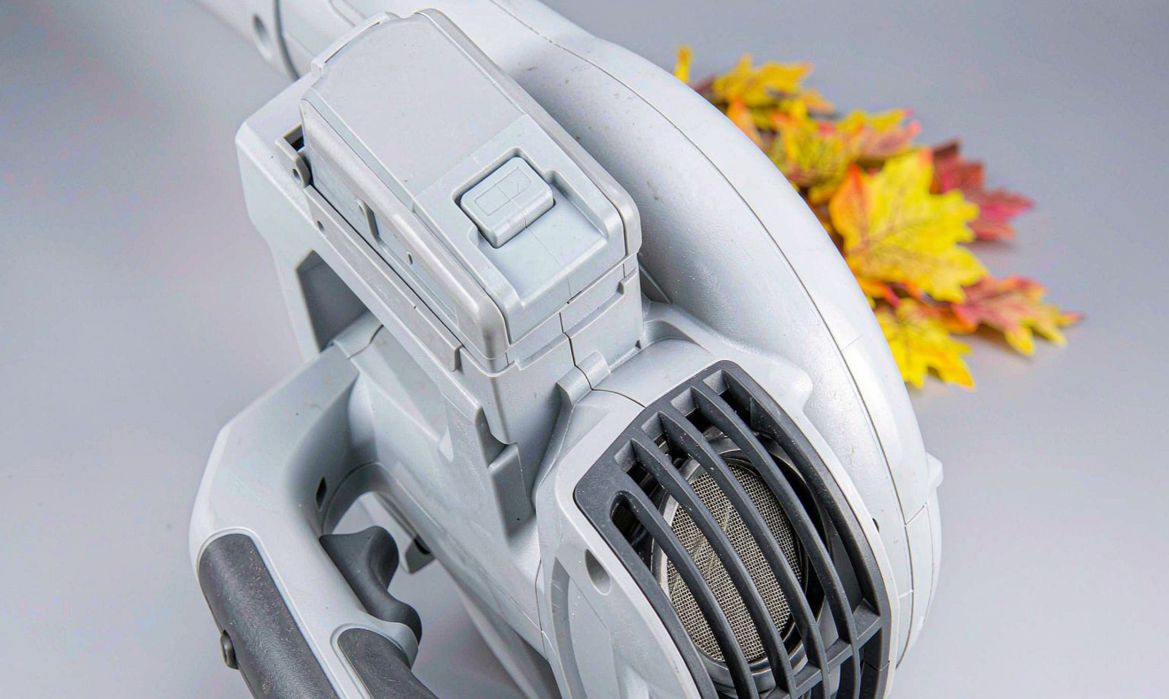 Lithium battery for cordless leaf blowers inserted in a handheld electric blower