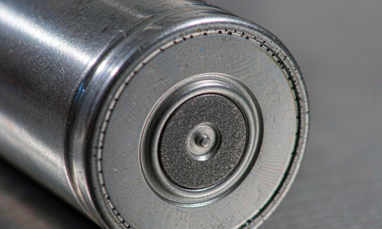 Semi-solid state battery vent design: cylindrical cell end cap with a scored burst disc and laser-welded rim