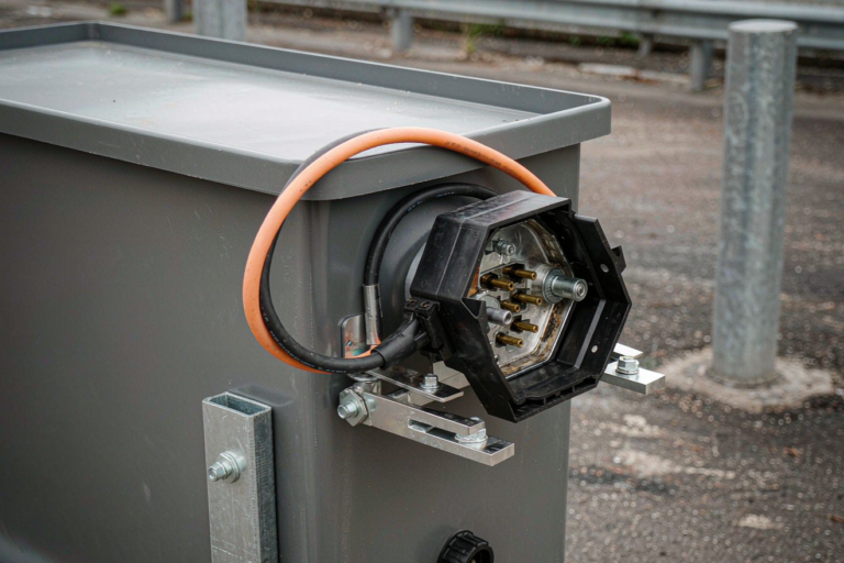 Battery solution for port ground support equipment with an industrial charging connector in a terminal yard