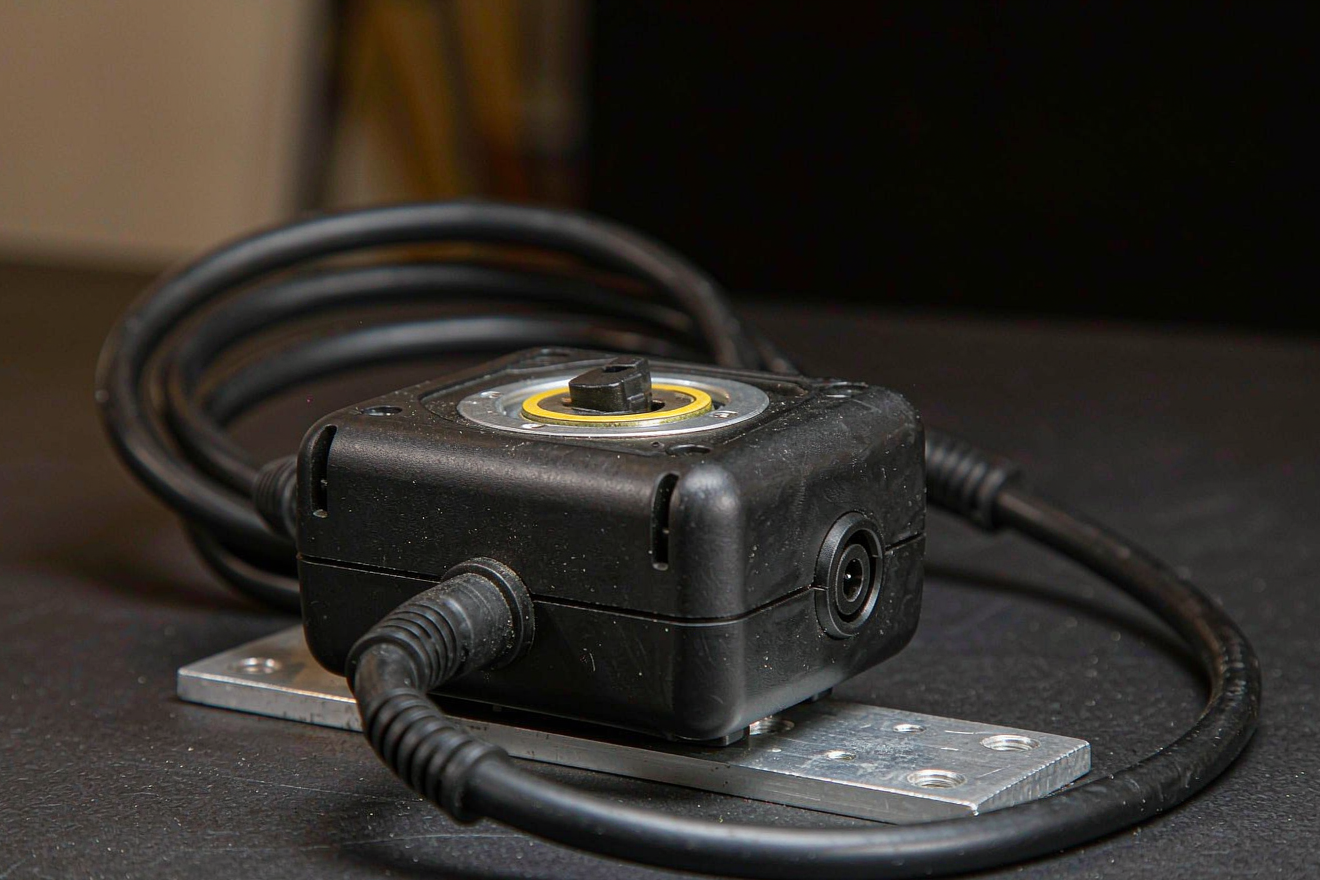 Lithium battery for film lighting: a rugged matte black pack with a multi-pin mount connector and DC output for portable rigs