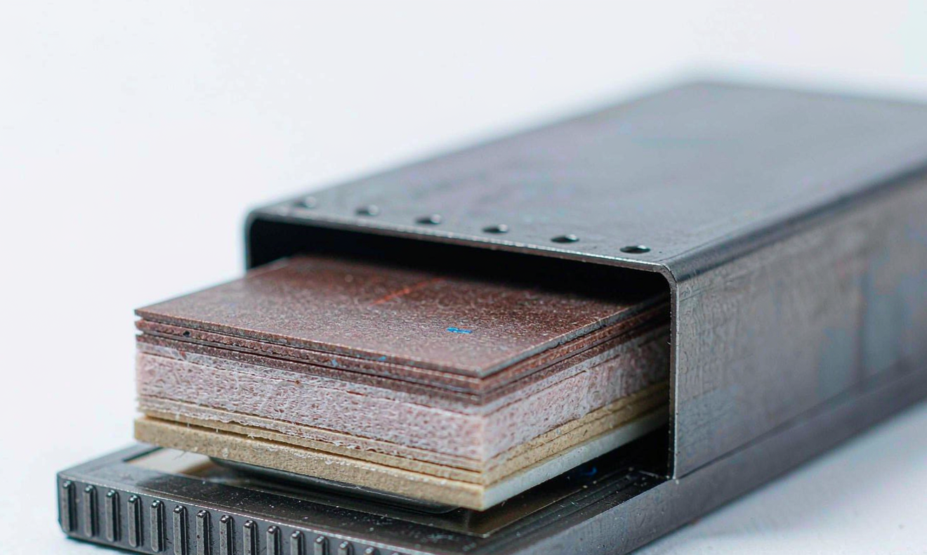 semi-solid state battery N/P ratio design cutaway showing layered anode, composite electrolyte and cathode